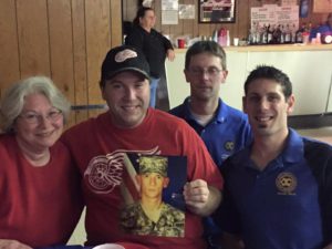 Lincoln Park, MI: Lincoln Park Exchange Club members brought a photo of Sandon Elkins, a club member on active military duty to their 11/11@7 event. "He wasn't able to attend so we brought his picture so he was there in spirit," said club member Maureen Cole Tobin. Thank you for your service, Sandon! Photo Courtesy Maureen Cole Tobin