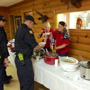 Murfreesboro, TN: A group of Murfreesboro firefighters are served by Noon Exchange Club of Murfreesboro, TN members Pat Houseman and Rebecca Talley at the club's 11/11@7 event. Photo Courtesy News Radio WGNS